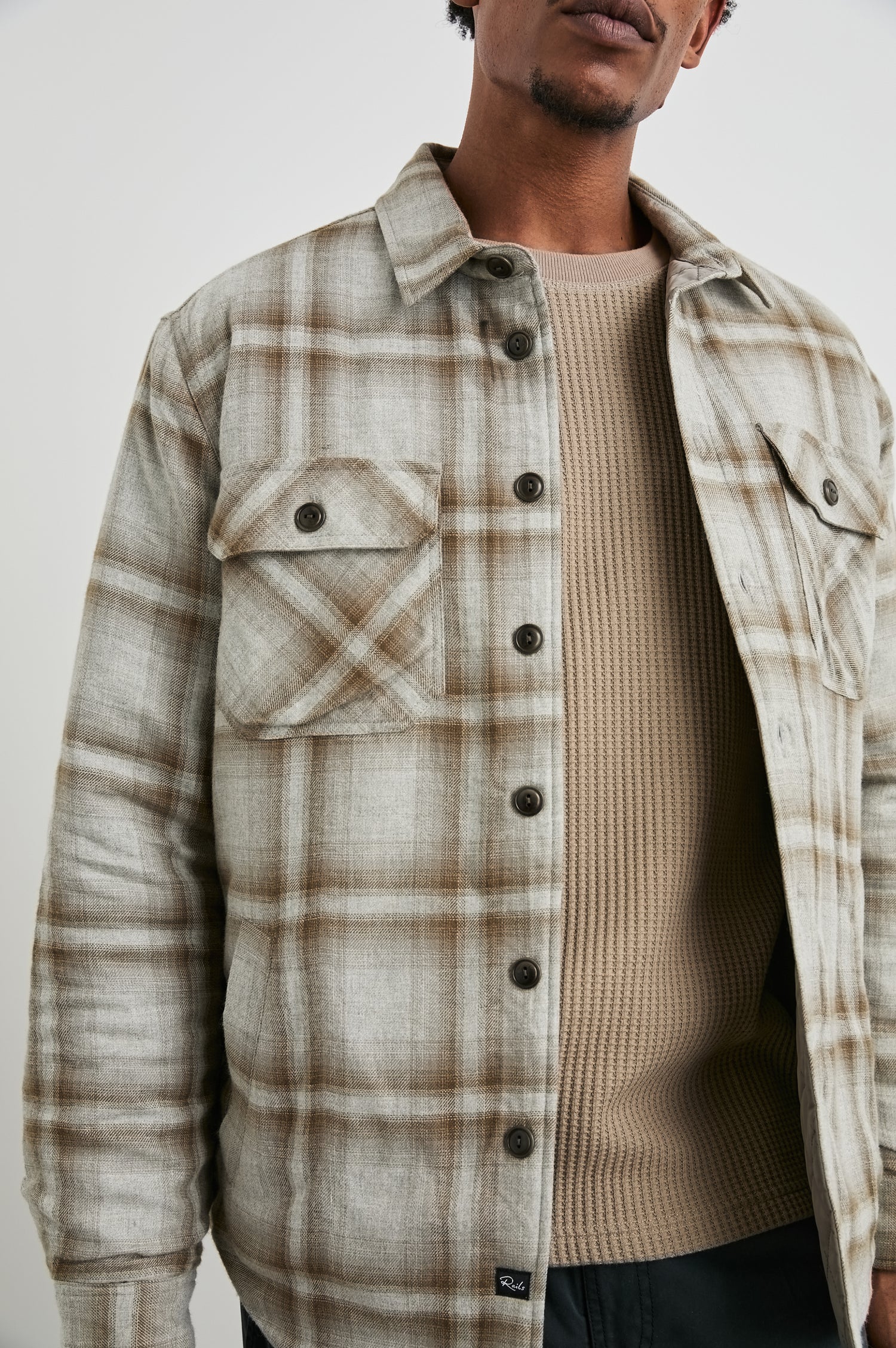 Men's Worthing lightweight jacket featuring a unique Matchbook Moth vintage-inspired print. Close up view of model featured.