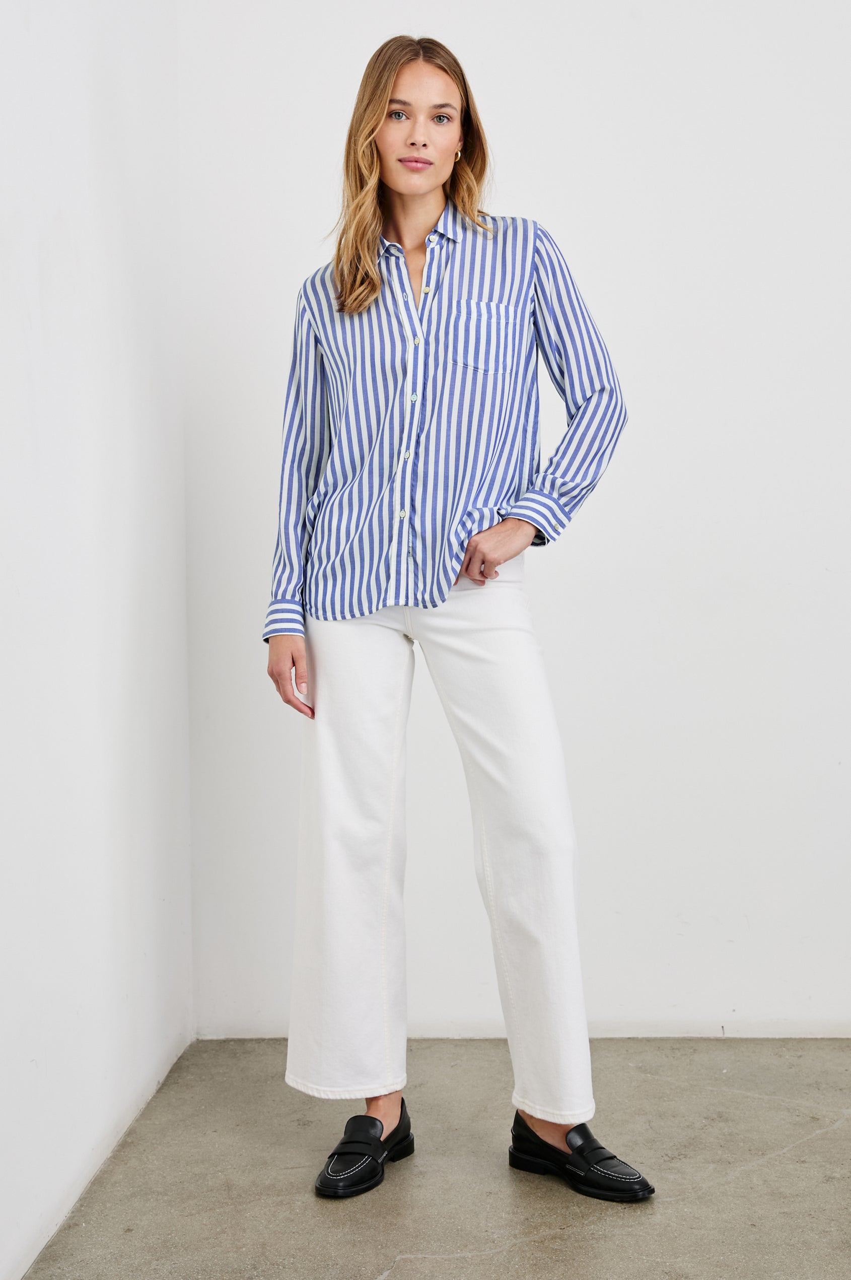 Wren Long-Sleeve Button Up with Chest Patch Pocket in Blue White Colorway, vertical stripes - Front Tucked Full Body View Featured on Model