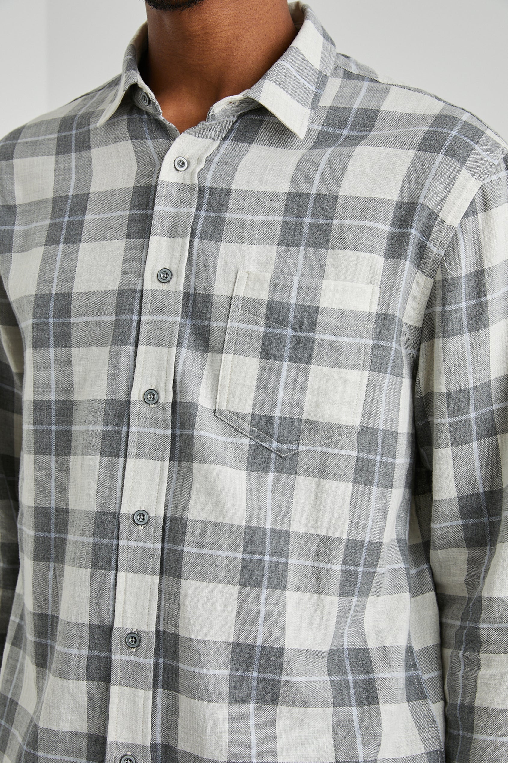 Wyatt Long-Sleeve Button Up with a Chest Patch Pocket in Anthrocite Sky Melange Colorway, a plaid with Anthrocite, Sky and Cream - Front View Featured on Model