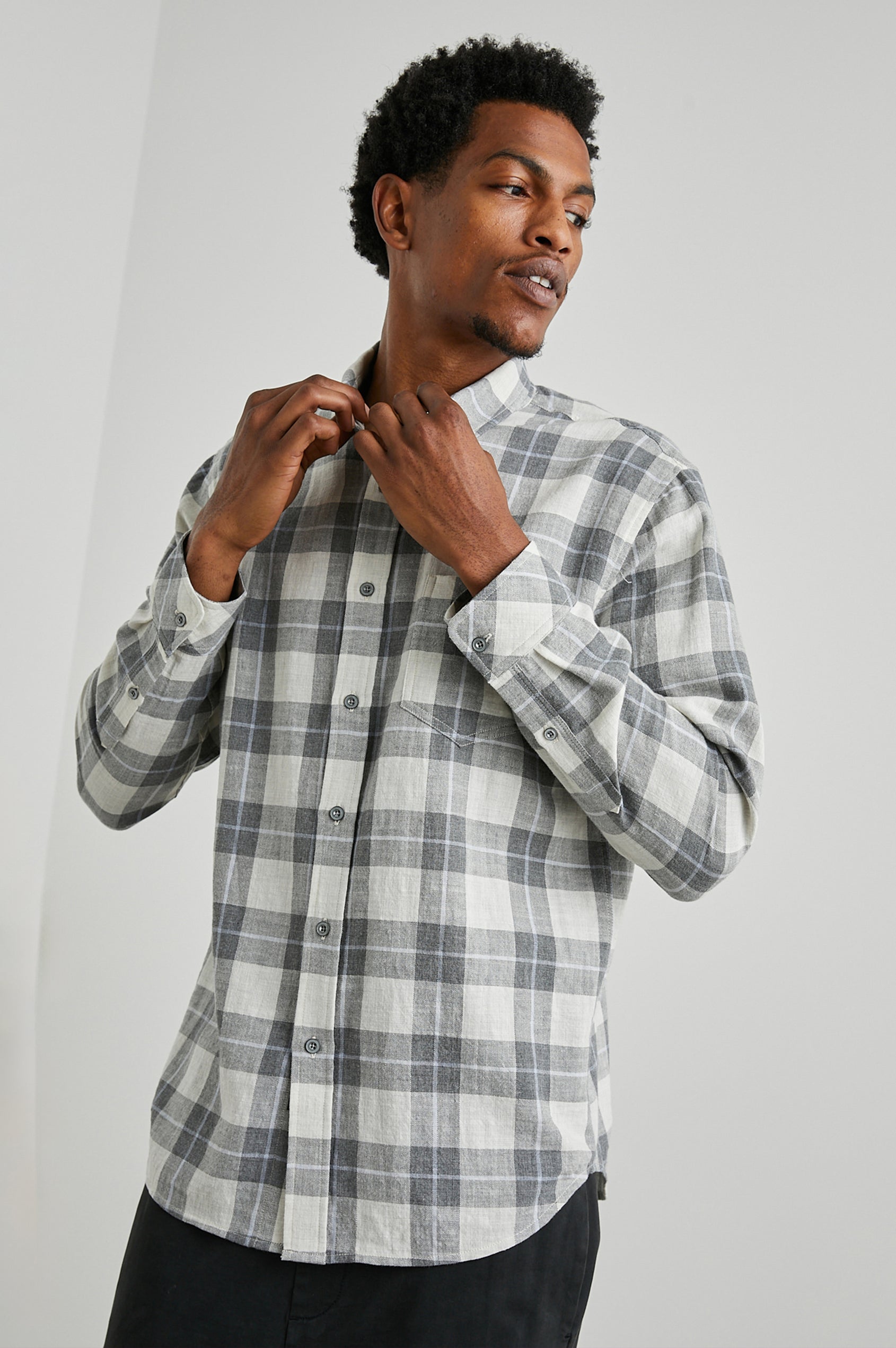 Wyatt Long-Sleeve Button Up with a Chest Patch Pocket in Anthrocite Sky Melange Colorway, a plaid with Anthrocite, Sky and Cream - Front View Featured on Model