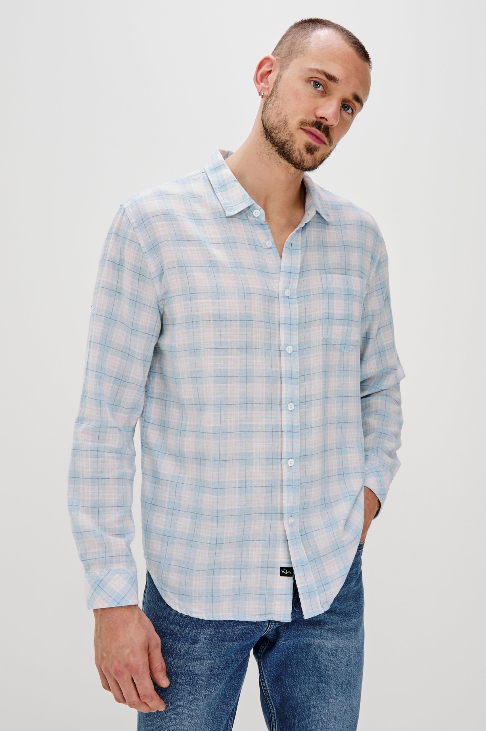 Wyatt Classic Button Up Long Sleeve Shirt with front chest pocket and plaid print in Apres Ocean Melange - front view on model, hand in pocket