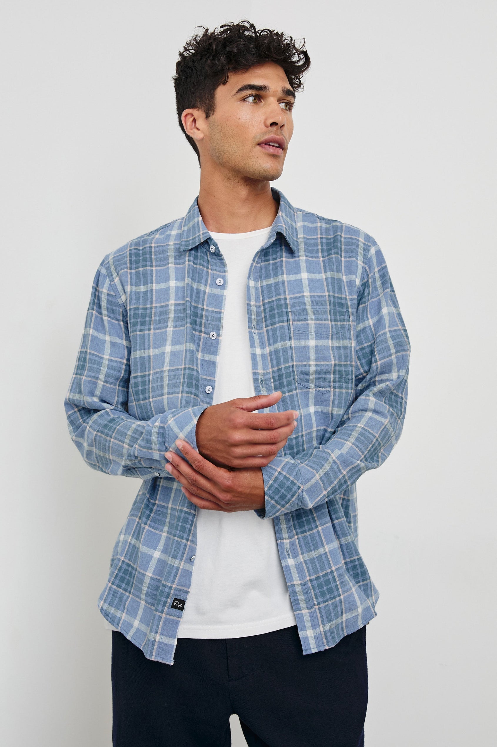 Wyatt Classic Button Up Long Sleeve Shirt with plaid print in Blue Ebi Melange - front view on model, hands in front