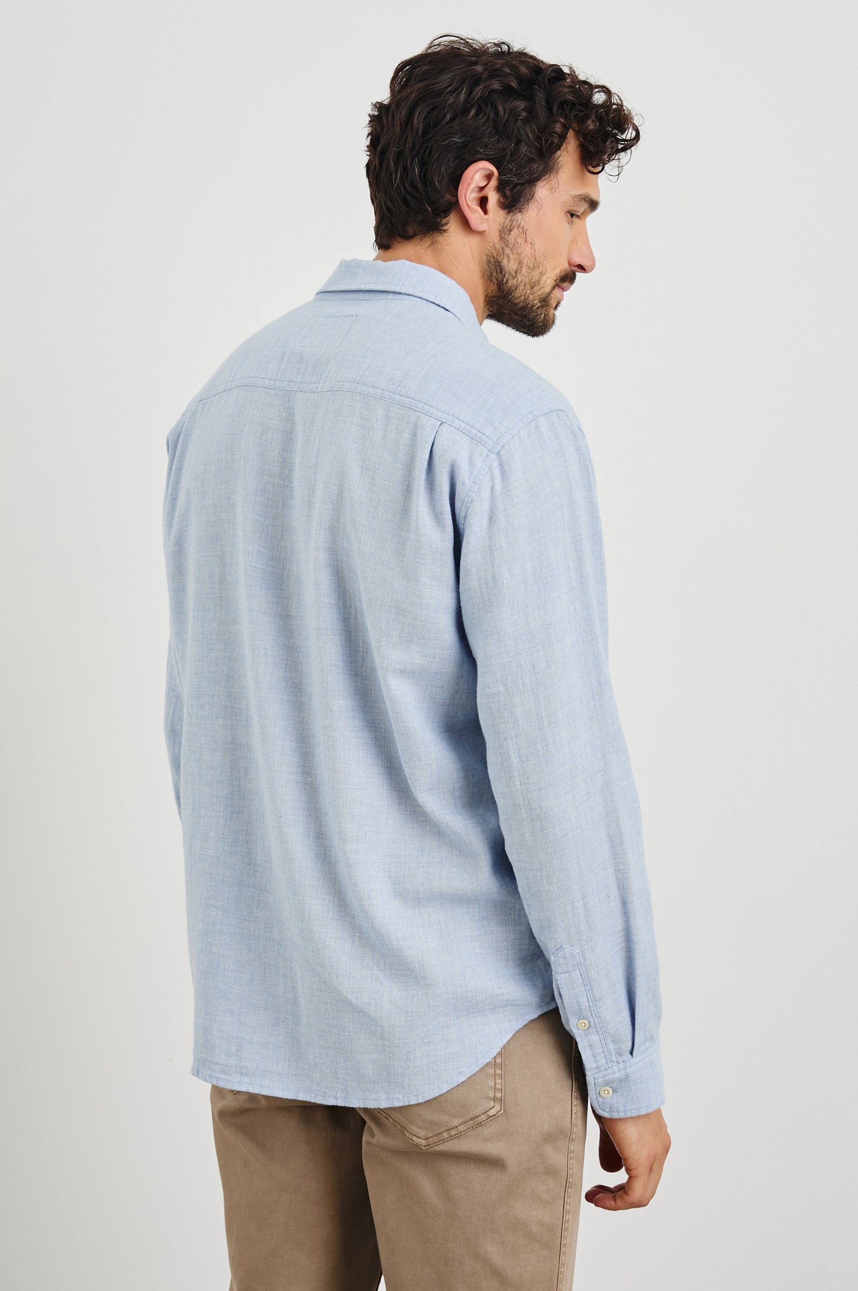 Wyatt Long-Sleeve Button Up with a Chest Patch Pocket in Blue Melange Colorway - Back View Featured on Model