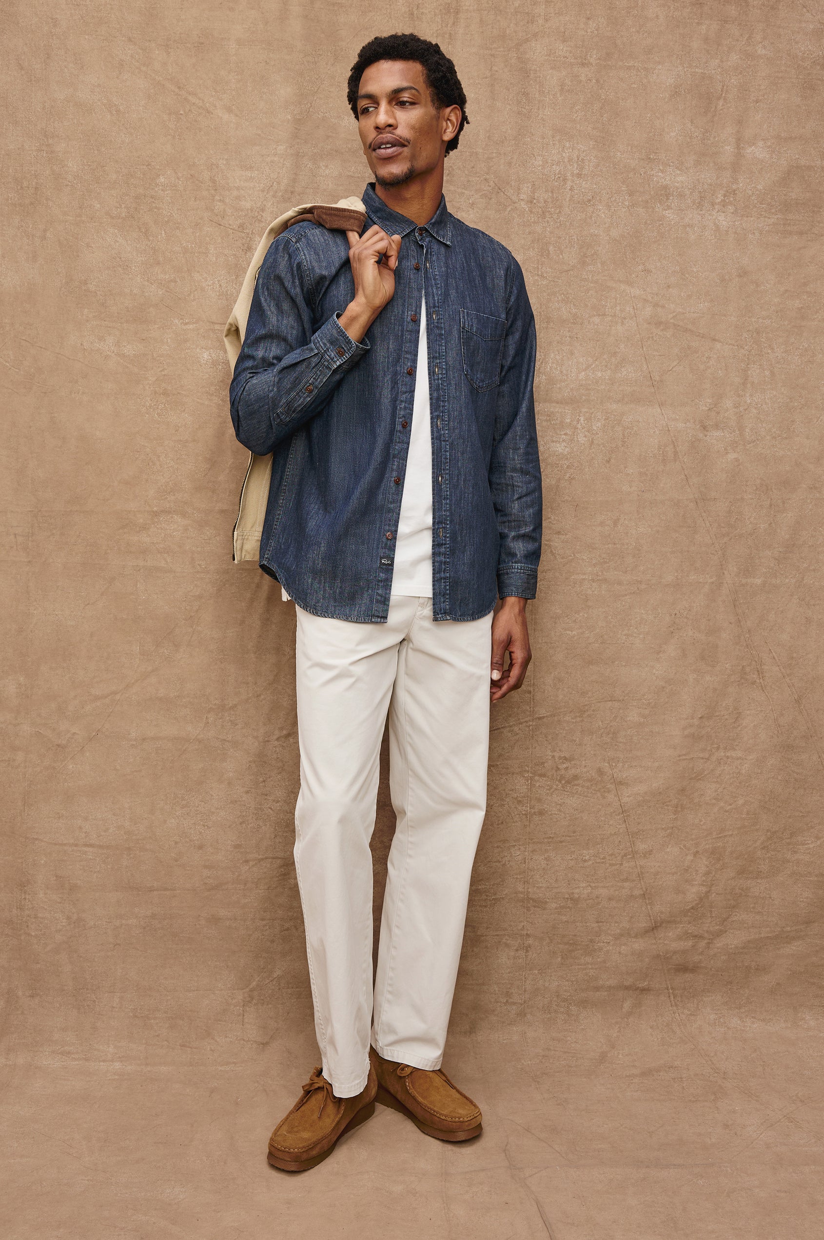 Colton Long-Sleeve Denim Button Up with a Chest Patch Pocket in Dark Wash Indigo Colorway - Front Unbuttoned Full Body View Featured on Model 