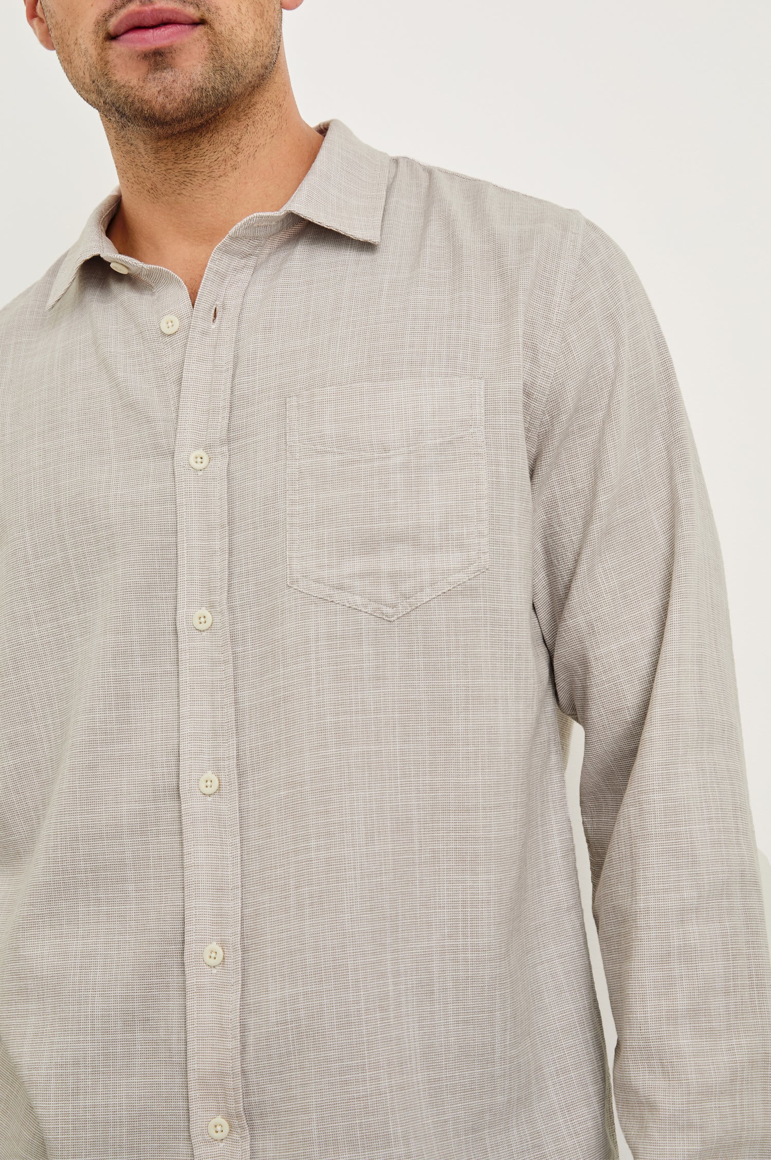 Wyatt Long-Sleeve Relaxed Fit Button Up with a Chest Patch Pocket in Tahini Etch Colorway - close up of details on model