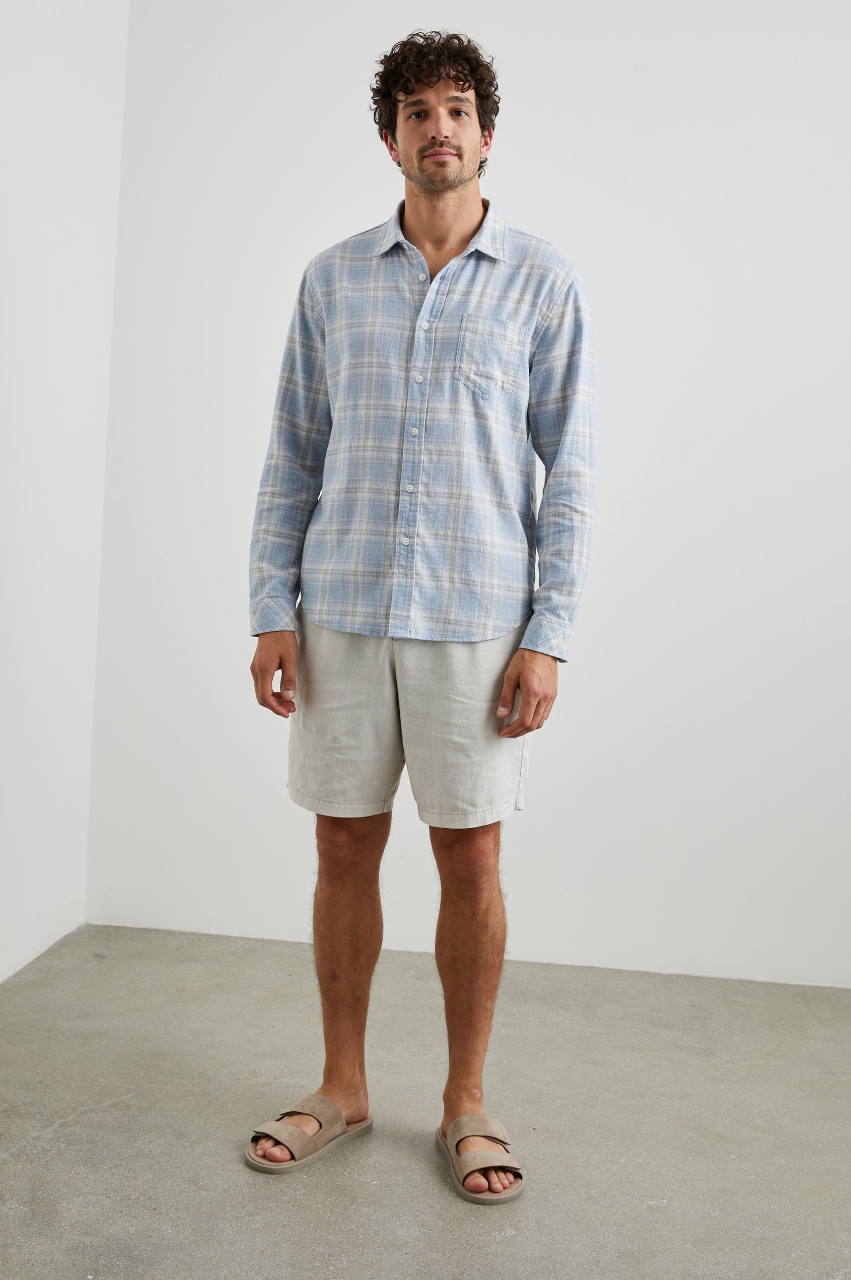 Wyatt Long-Sleeve Button Up with a Chest Patch Pocket in Rose Waterfall Colorway, a blue, grey and white plaid - Front Full Body View Featured on Model