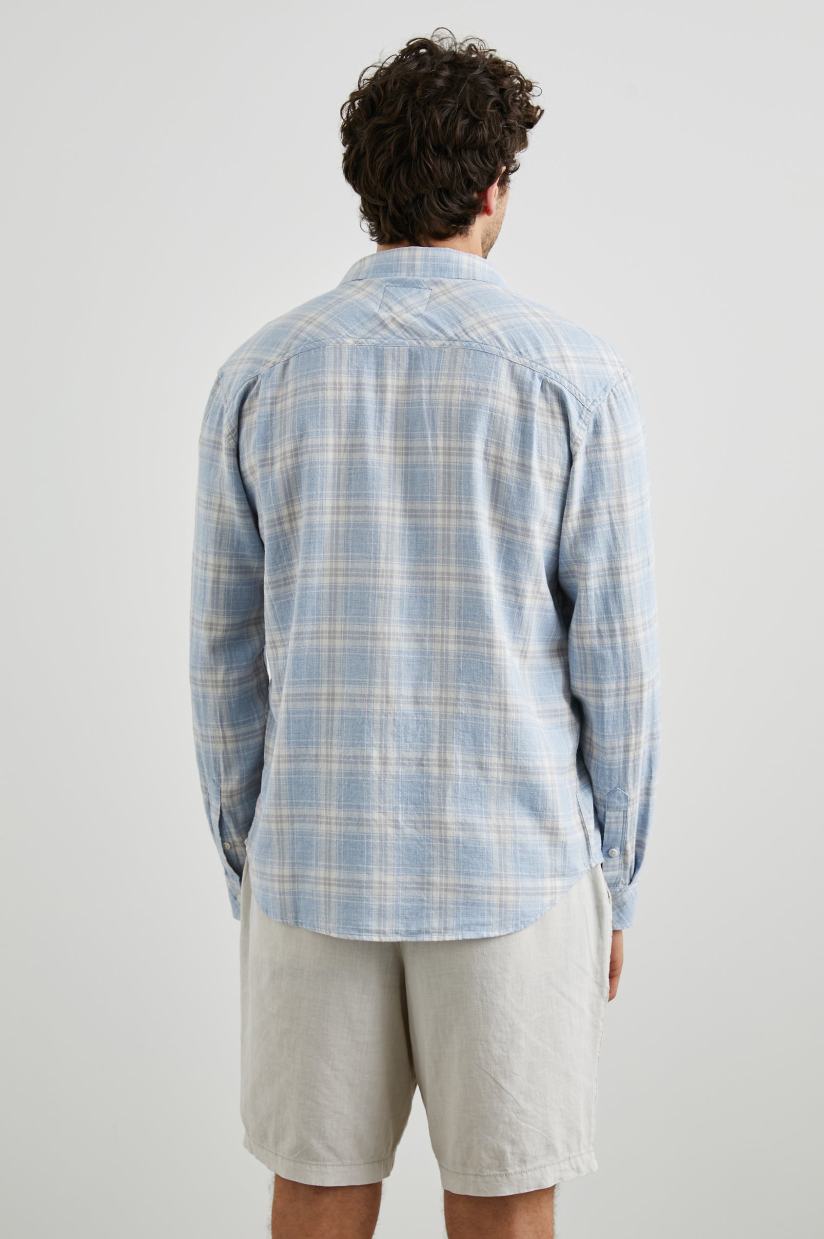 Wyatt Long-Sleeve Button Up with a Chest Patch Pocket in Rose Waterfall Colorway, a blue, grey and white plaid - Back View Featured on Model