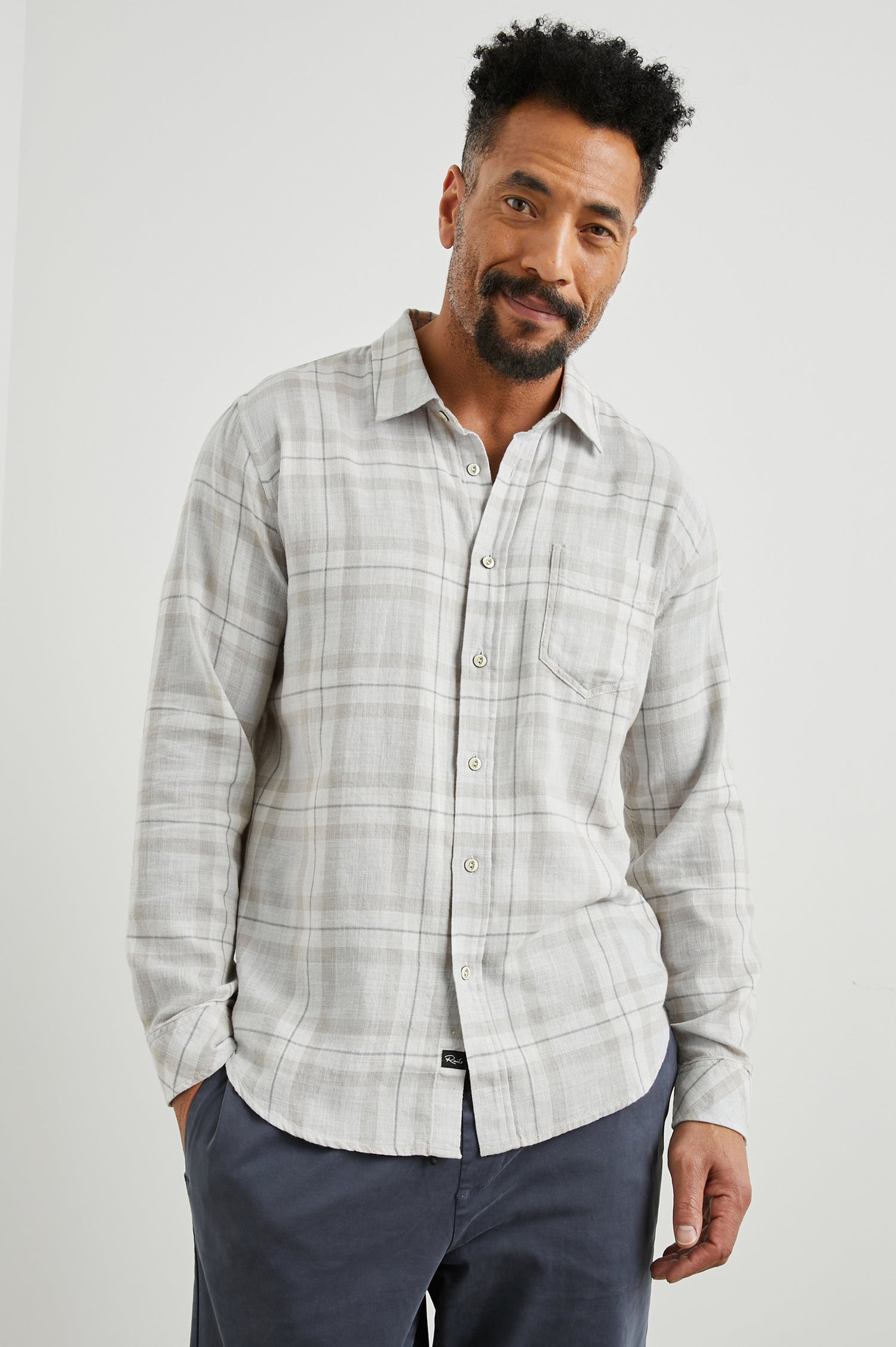 Wyatt Long-Sleeve Button Up with a Chest Patch Pocket in Tapir Agave Melange Colorway, a Tapir, Agave and cream plaid - Front View Featured on Model