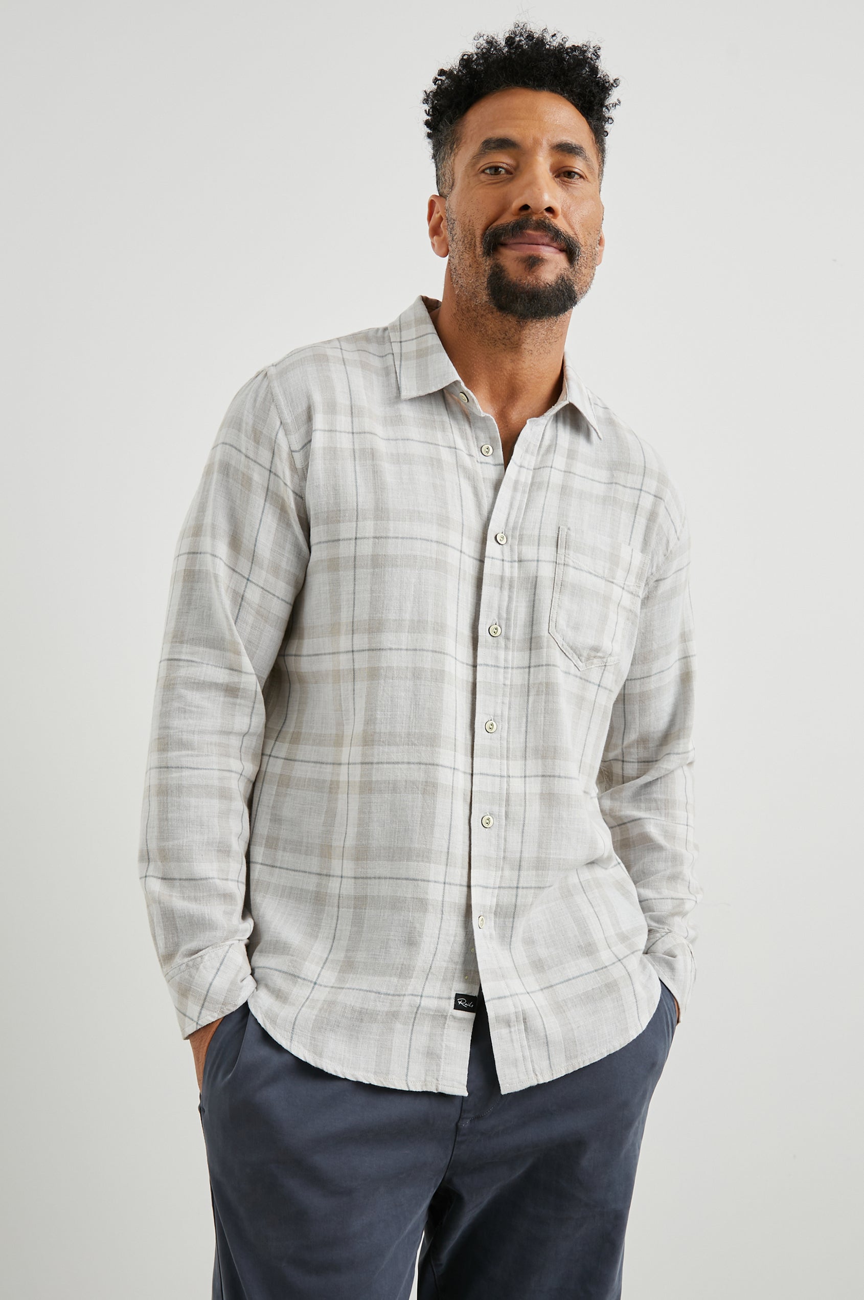Wyatt Long-Sleeve Button Up with a Chest Patch Pocket in Tapir Agave Melange Colorway, a Tapir, Agave and cream plaid - Front View Featured on Model