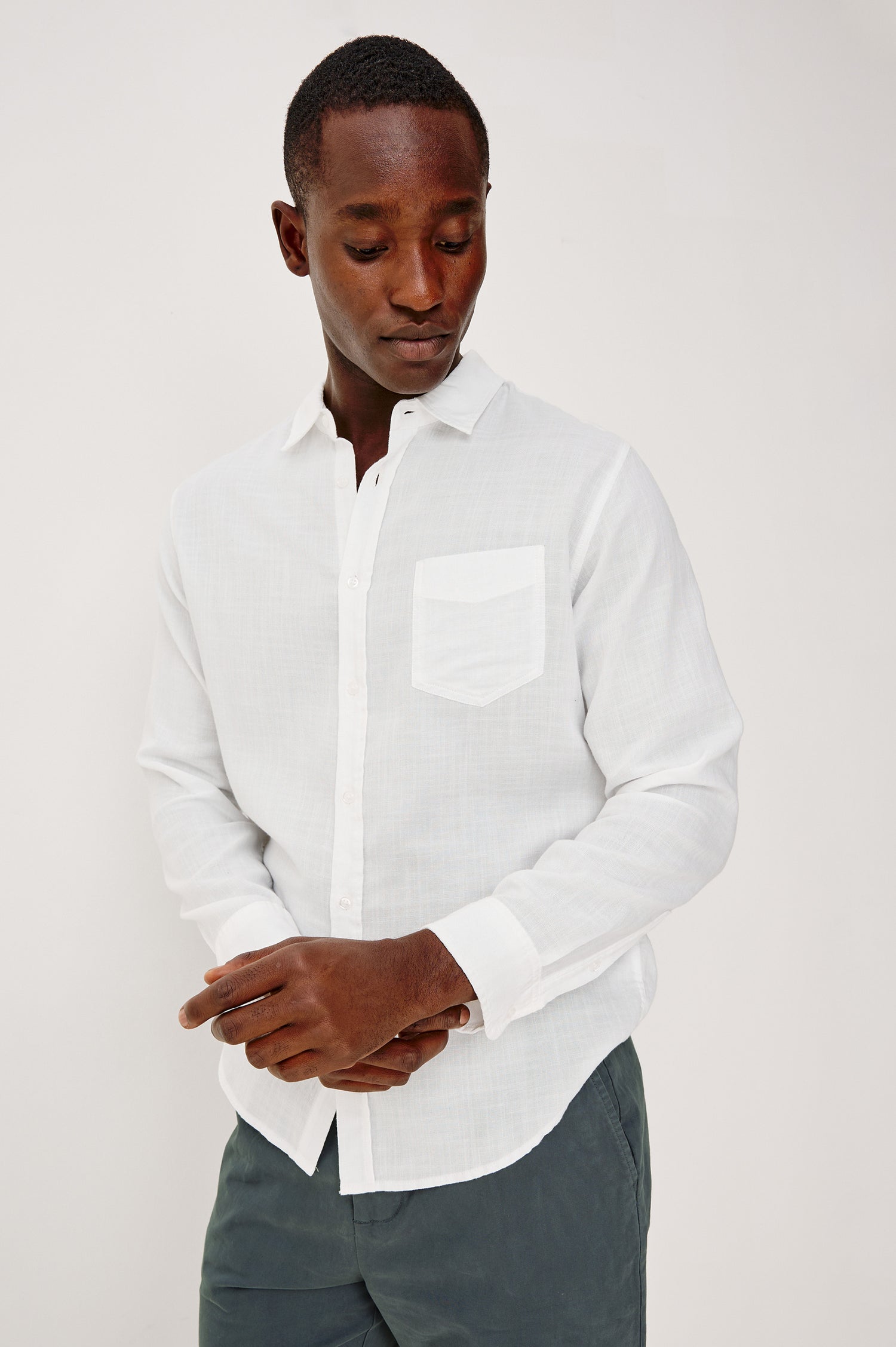 Wyatt Button Front Collared Shirt With Long Sleeves and Single Chest Pocket in White Colorway - Upper Body Front View Featured on Model