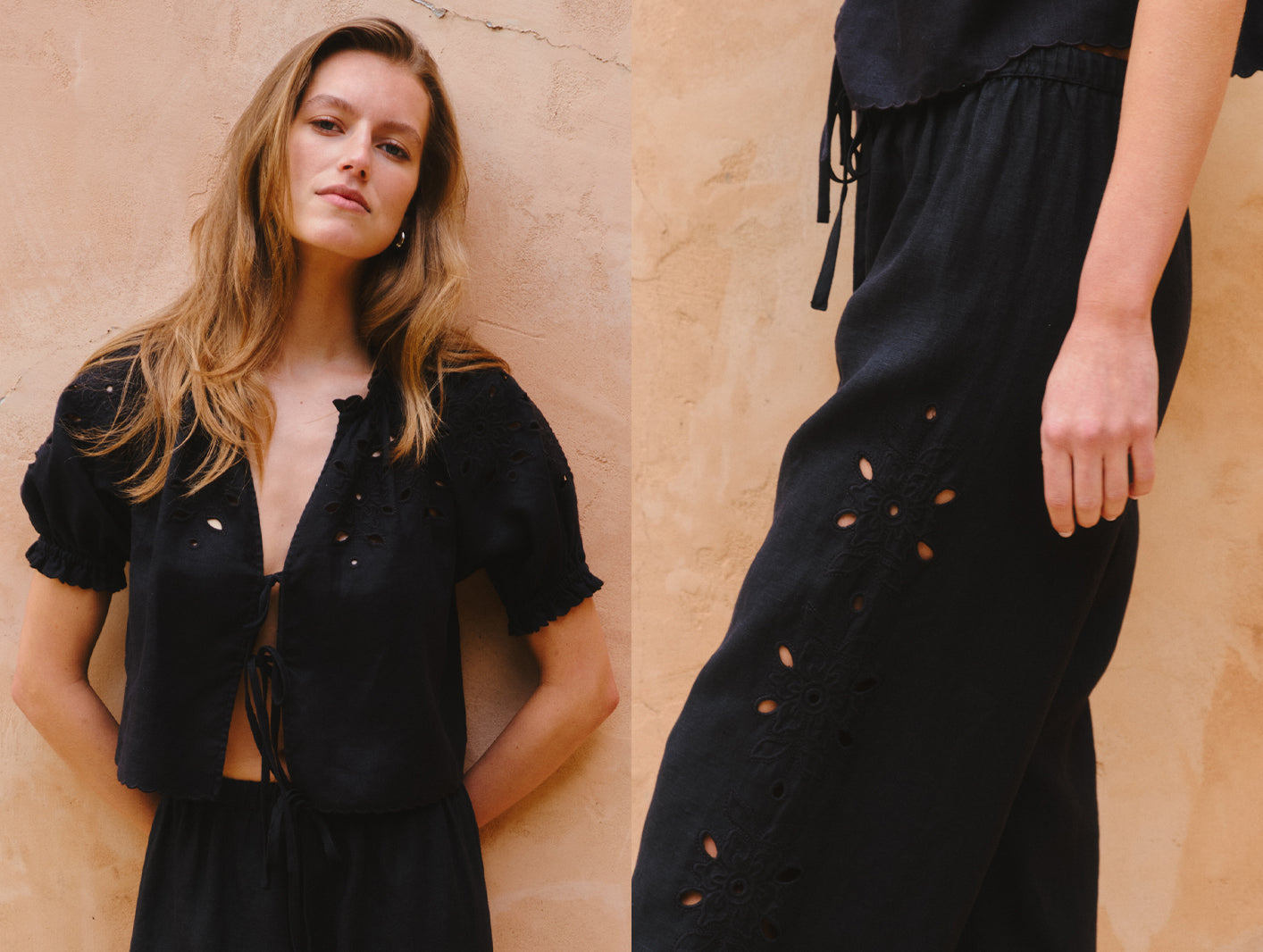 Woman wearing a black outfit with cut-out details against a beige wall.