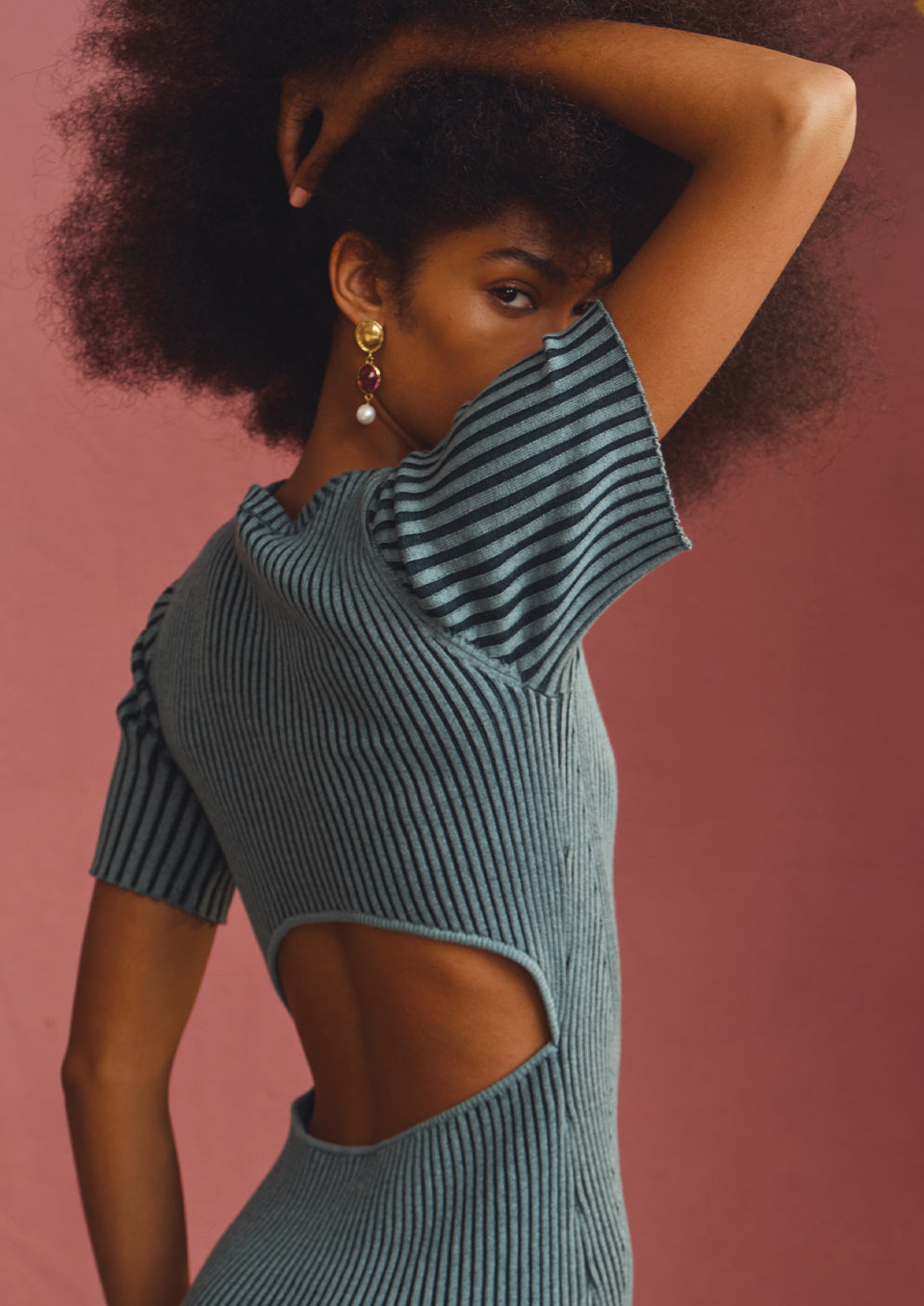 BACK EDITORIAL IMAGE OF MODEL WEARING GENESIS DRESS