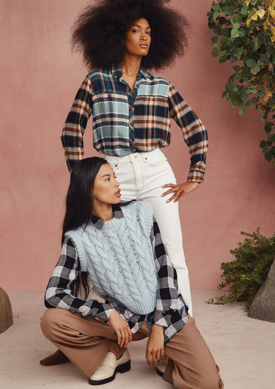 TWO MODELS. FIRST MODEL IS STANDING WEARING HUNTER SHIRT. SECOND MODEL IS KNEALING WEARING ALEXIS SWEATER VEST.