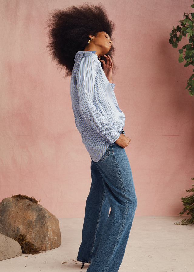 EDITORIAL SIDE IMAGE OF MODEL WEARING SPENCER SHIRT