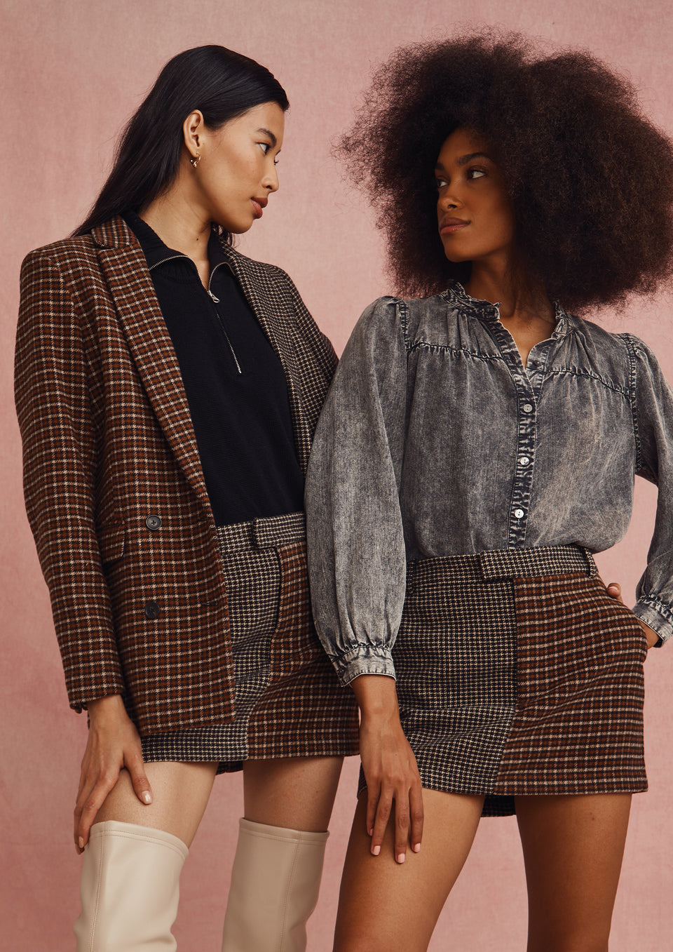 EDITORIAL SHOT OF TWO MODELS. FIRST MODEL IS WEARING CODY BLAZER AND PRIM SKIRT. SECOND MODEL IS WEARING CAMILLE TOP