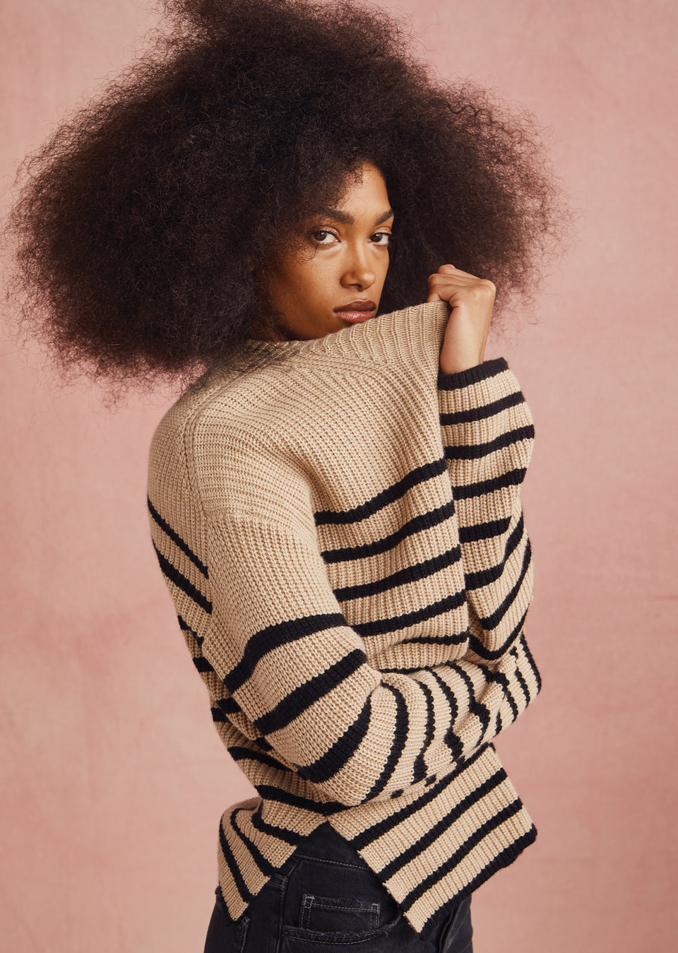 EDITORIAL SIDE IMAGE OF MODEL WEARING CLAUDIA SWEATER