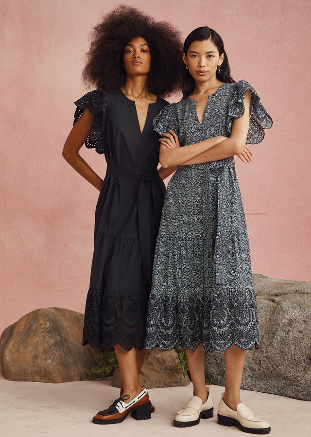 TWO MODELS STANDING NEXT TO EACH OTHER. FIRST MODEL IS WEARING KYRA DRESS AND SECOND MODEL IS WEARING GIA DRESS