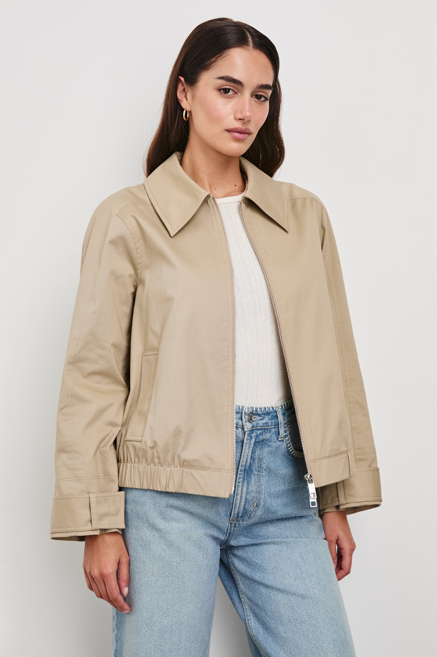 York Jacket takes a classic fit in washed cotton canvas, elastic at the hem and cuffs in taupe colorway. Front view featured on model