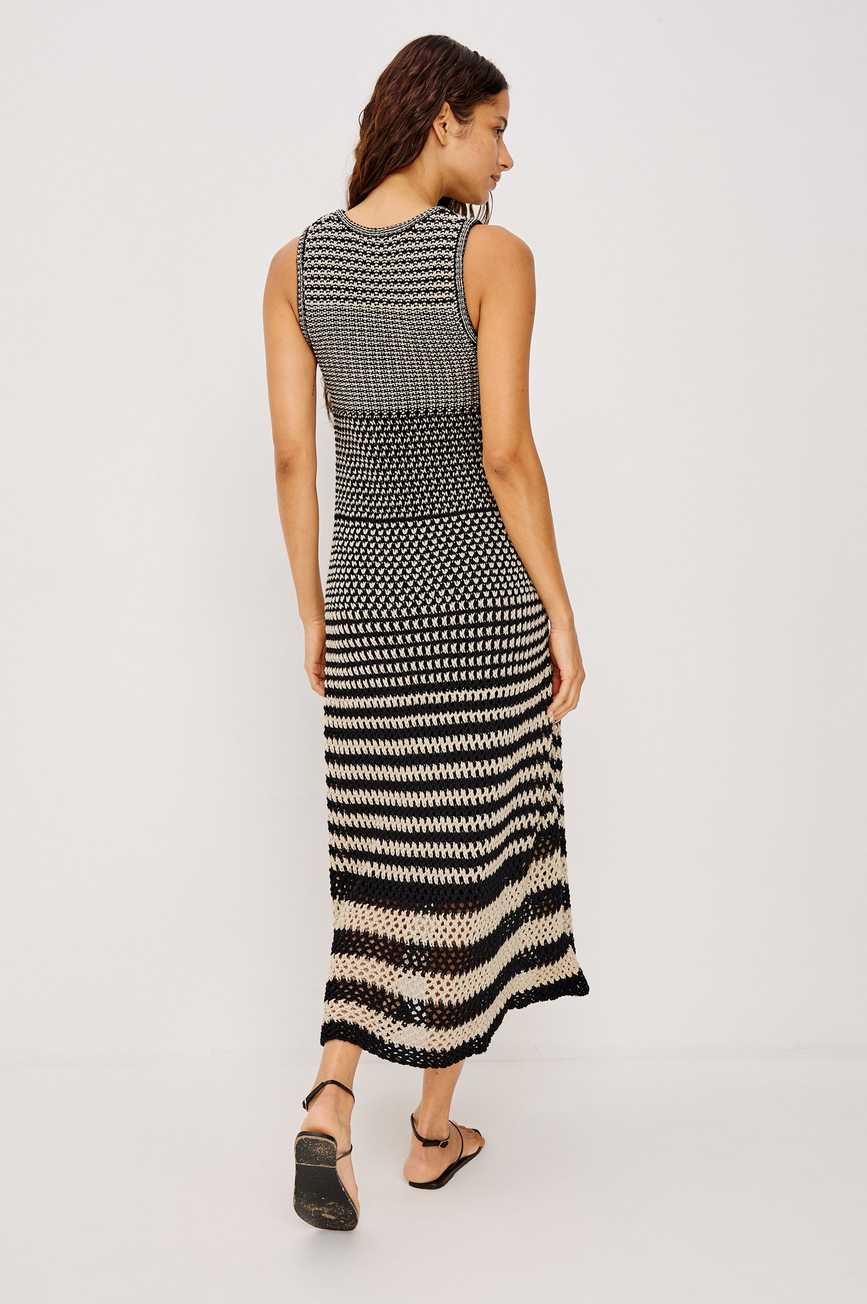 Yvette Maxi Dress in Cotton Knit With Scoop Neckline, Slightly Fitted at Top With A-Line Body, Side Slits, and Jersey Lining in Onyx Ivory Stripe Colorway - Full Body Back View Featured on Model