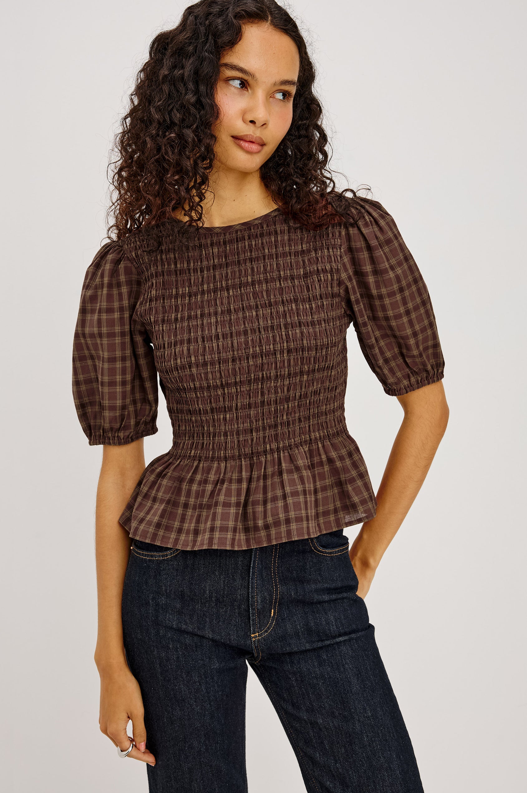 Zane Shirt in Brushed Cotton With Fitted Smocked Body, Elbow-Length Puff Sleeves With Elastic Cuffs, Adjustable Keyhole Tie at Back, and Peplum Hem in Espresso Olive Colorway - Upper Body Front View Featured on Model