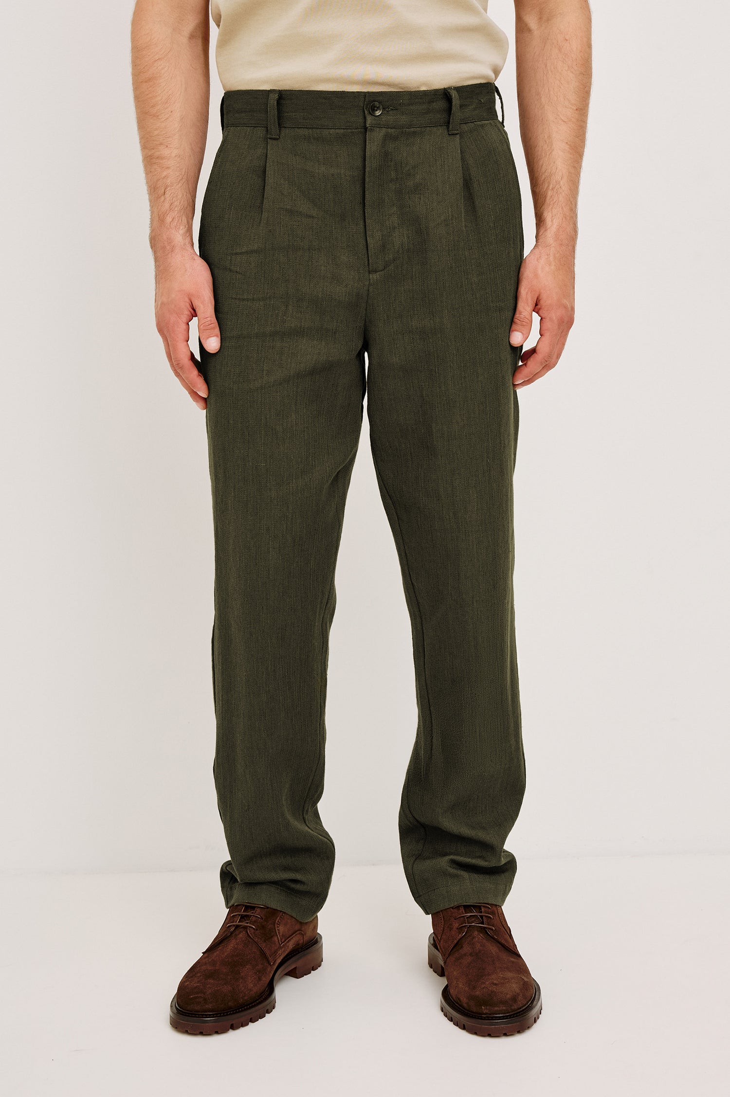 Zimmer Pant in Cotton Linen Wool Blend With Relaxed Fit, Tapered Leg, Side Pockets, Zip Fly, Belt Loops, and Back Welt Pockets in Deep Olive Colorway - Lower Body Front View Featured on Model