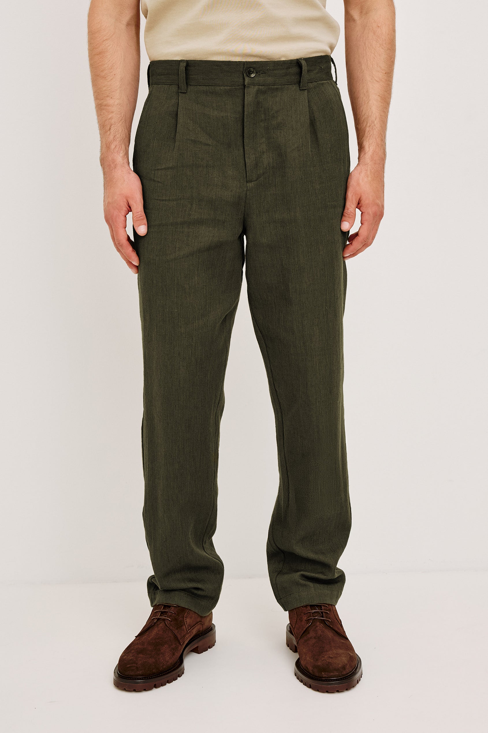 Zimmer Pant in Cotton Linen Wool Blend With Relaxed Fit, Tapered Leg, Side Pockets, Zip Fly, Belt Loops, and Back Welt Pockets in Deep Olive Colorway - Lower Body Front View Featured on Model