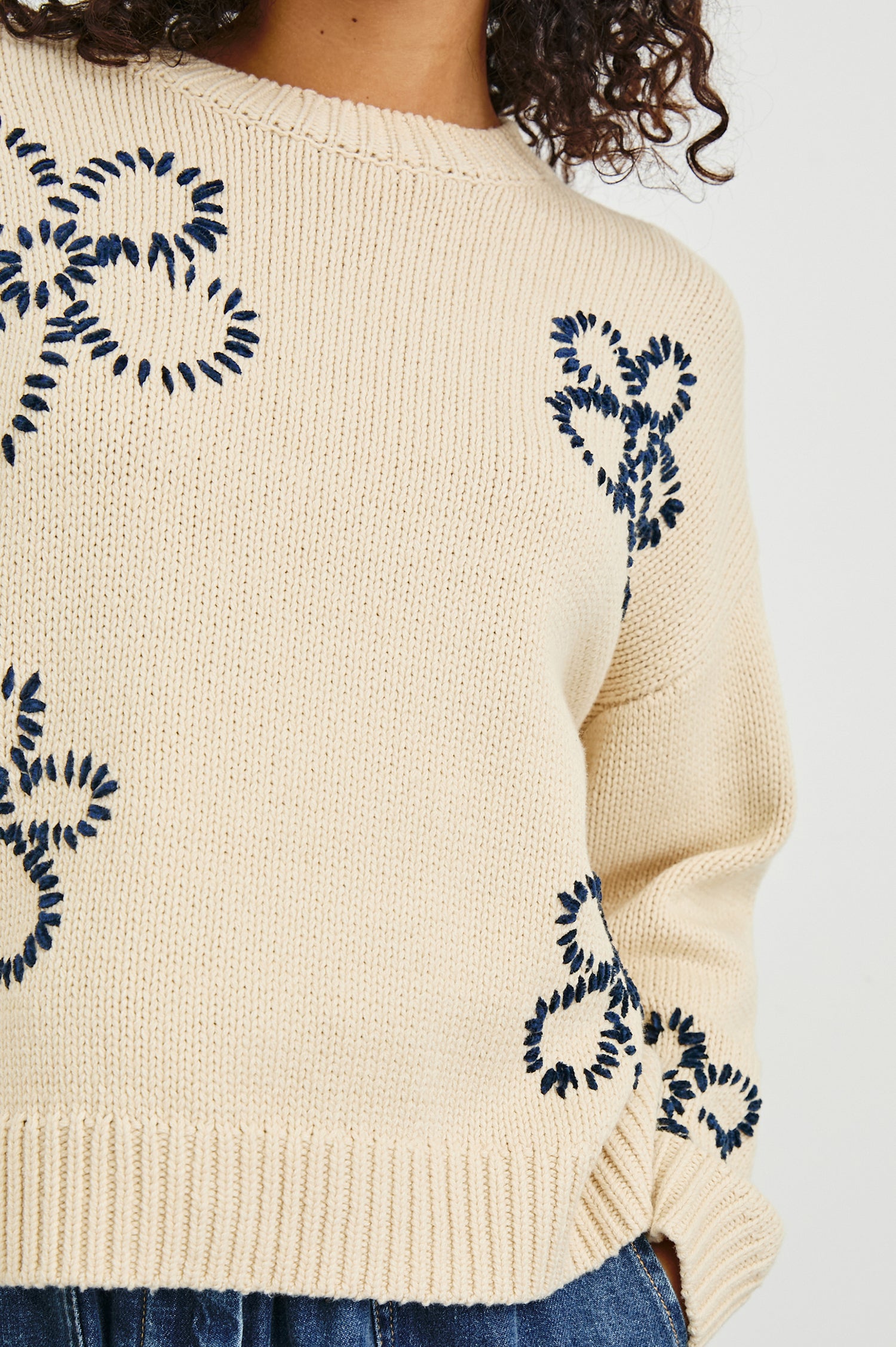 Zoey Long-Sleeve Sweater with Crewneck and Ribbed Trims in Ivory Navy Stitched Daisies Colorway, Navy Daisies on Ivory - Front View Featured on Model