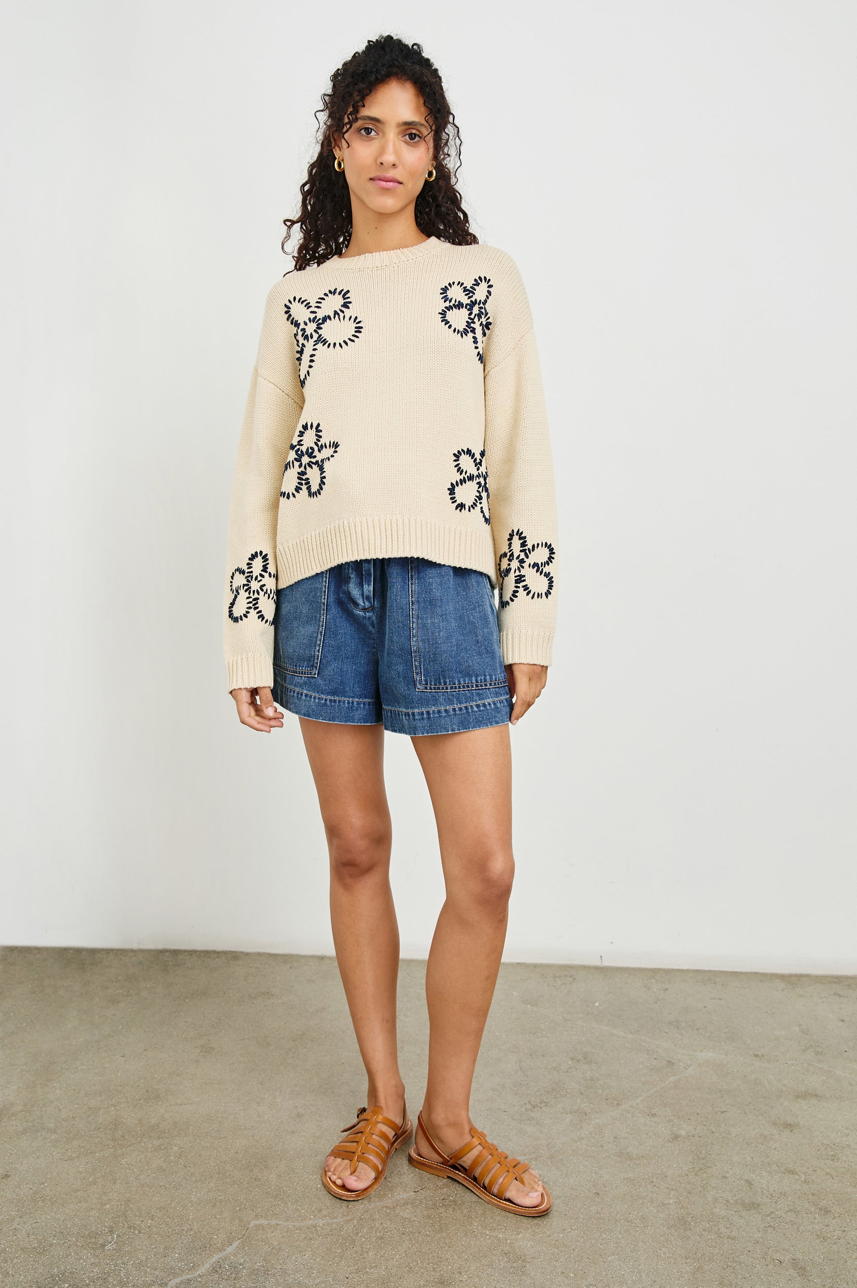 Zoey Long-Sleeve Sweater with Crewneck and Ribbed Trims in Ivory Navy Stitched Daisies Colorway, Navy Daisies on Ivory - Front Full Body View Featured on Model