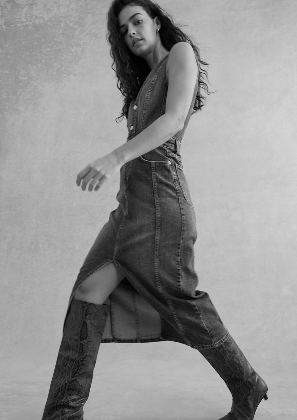 SIDE FULL BODY BLACK AND WHITE IMAGE OF MODEL WEARING WESTWOOD DRESS