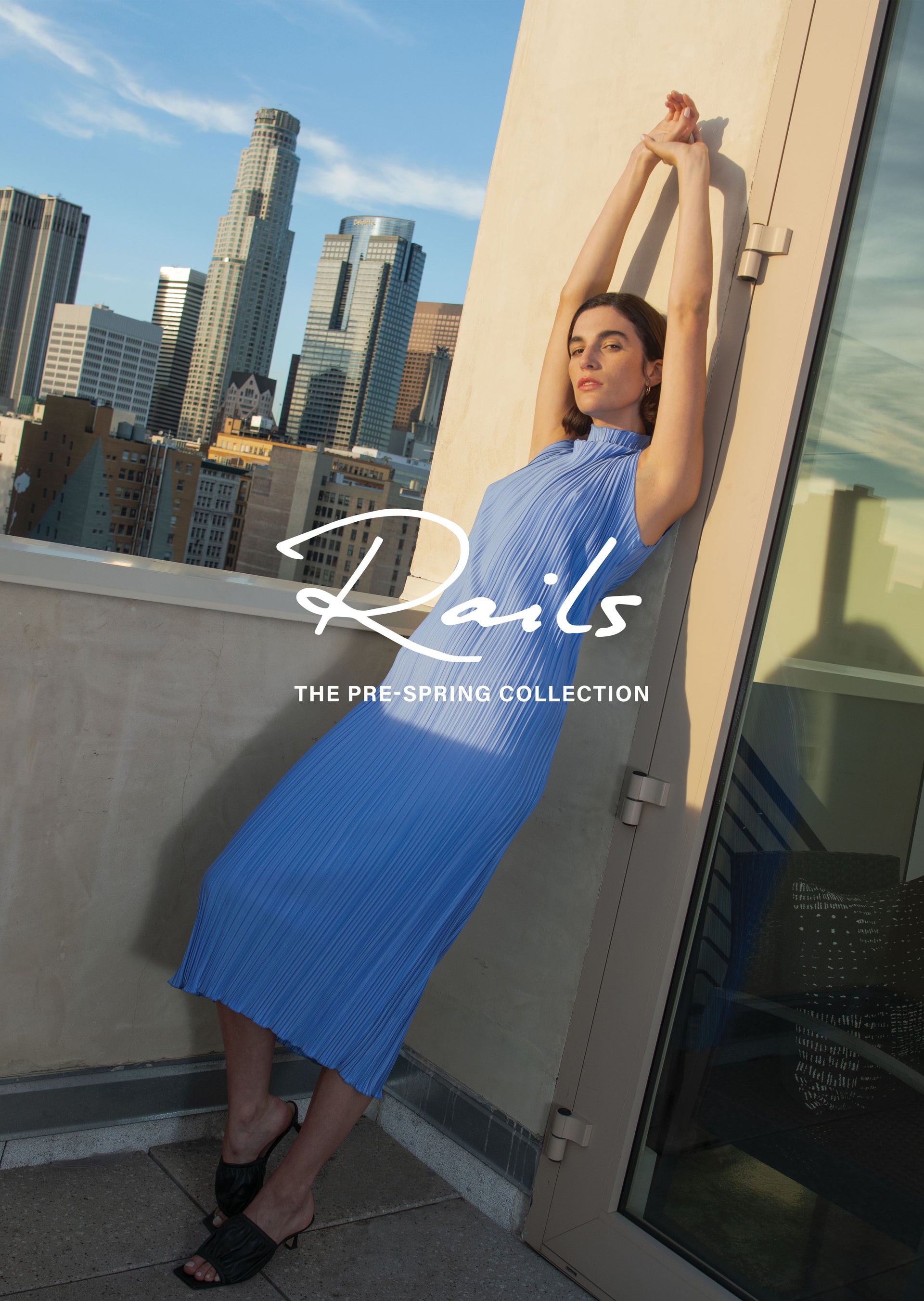 EDITORIAL IMAGE OF MODEL WEARING THE WAKELY DRESS IN JEWEL