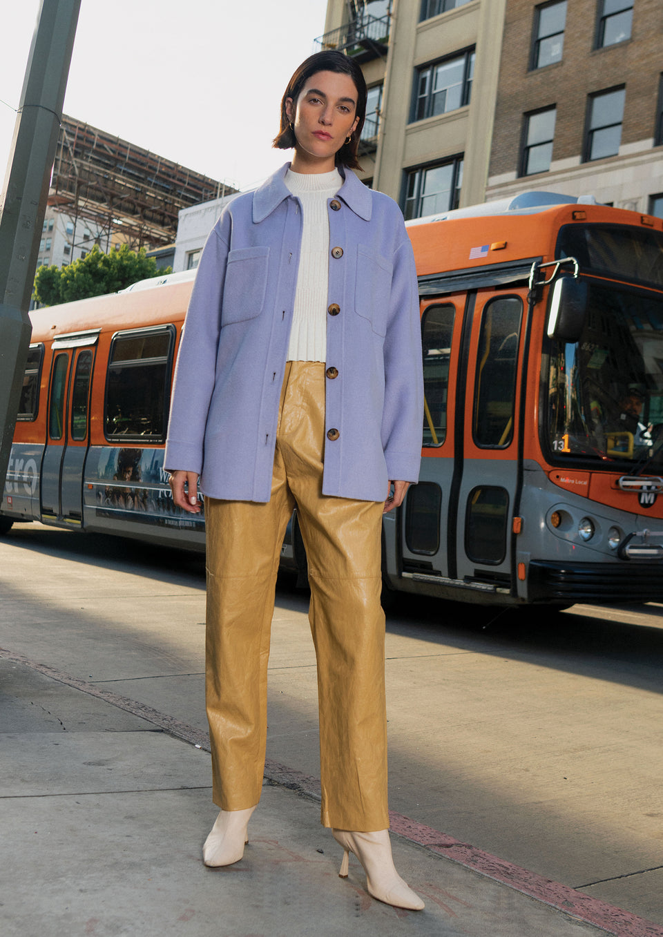 EDITORIAL FRONT SHOT OF MODEL WEARING CONNIE SHIRT JACKET IN LILAC AND JO PANT IN CAFE