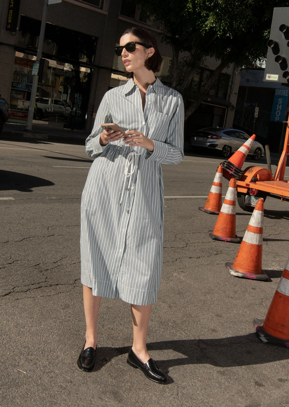 EDITORIAL IMAGE OF MODEL WEARING SHIVONNE DRESS IN BANK STRIPE
