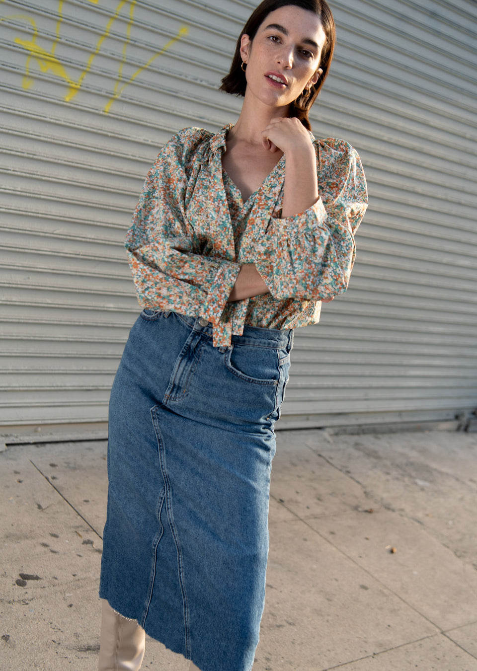 EDITORIAL FRONT SHOT OF MODEL WEARING AMAL TOP IN CASSIA AND HIGHLAND SKIRT IN VINTAGE SAPPHIRE