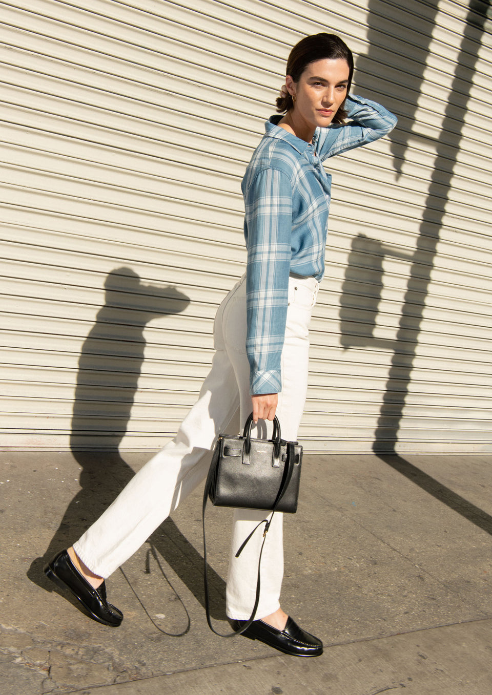 EDITORIAL SIDE SHOT OF MODEL WEARING HUNTER SHIRT IN HARBOR WHITE