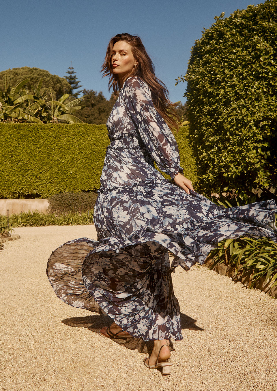 SIDE EDITORIAL IMAGE OF MODEL WEARING FREDERICA DRESS