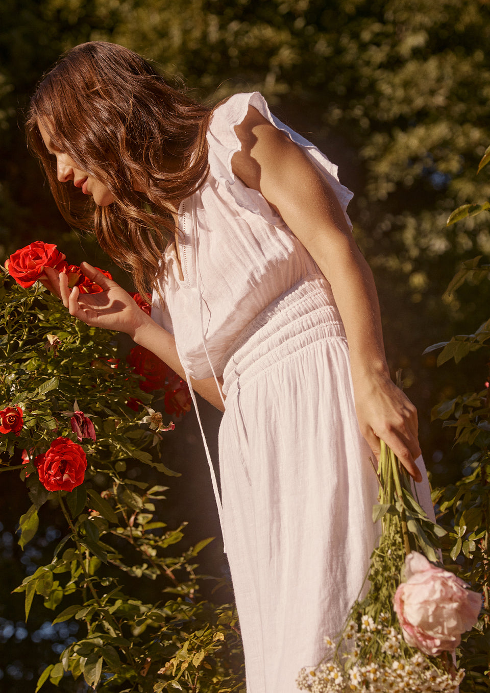 EDITORIAL IMAGE OF MODEL IN GARDEN WEARING IONA DRESS