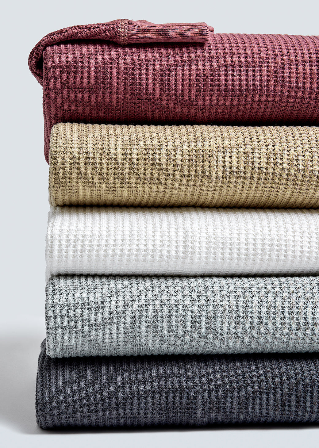 MULTIPLE WADE THERMAL SHIRTS FOLDED AND STACKED ON TOP OF EACH OTHER