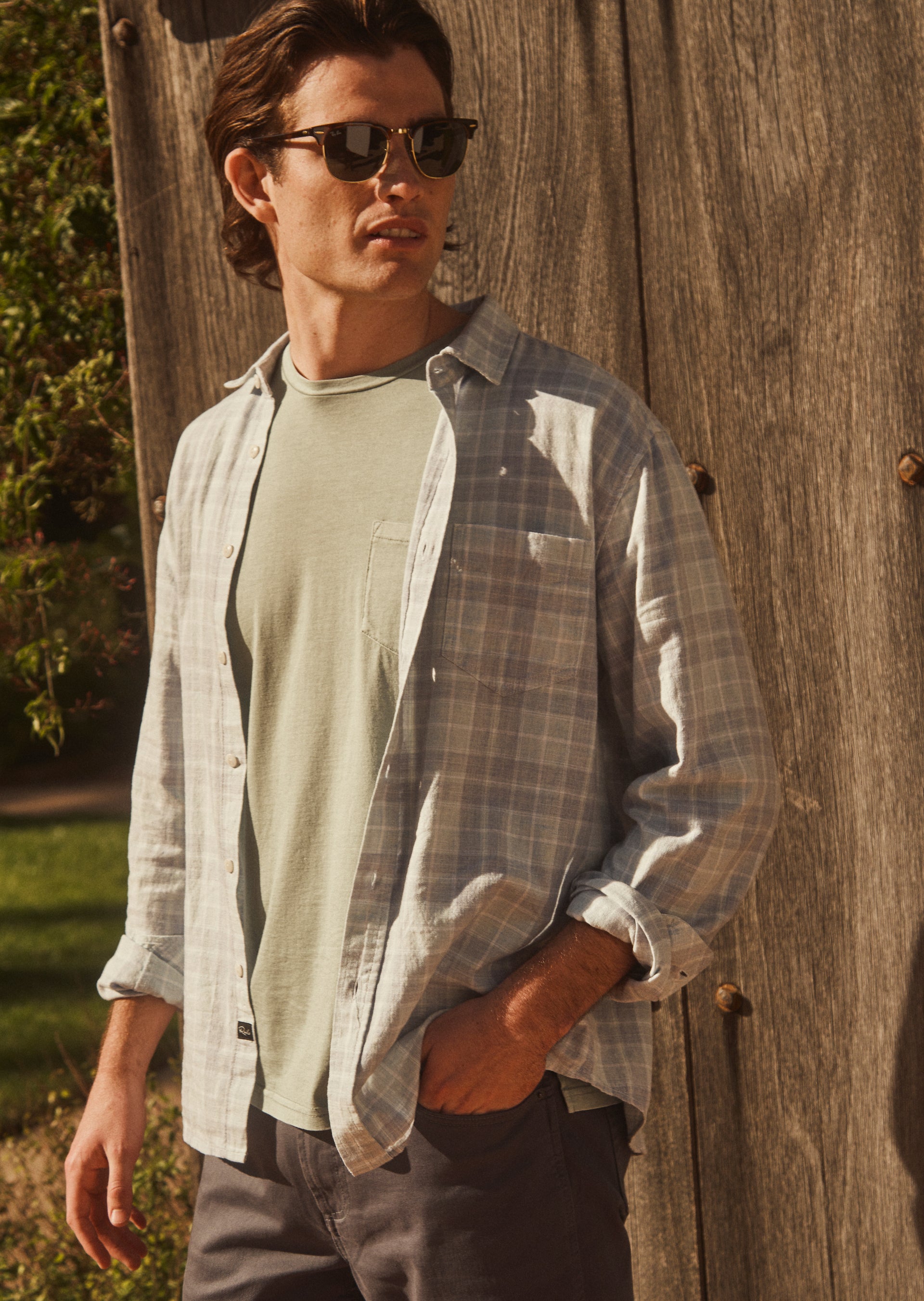 EDITORIAL IMAGE OF WYATT SHIRT IN BITTER MELON CLOUD MELANGE WORN OVER JOHNNY T-SHIRT IN HERER GREEN