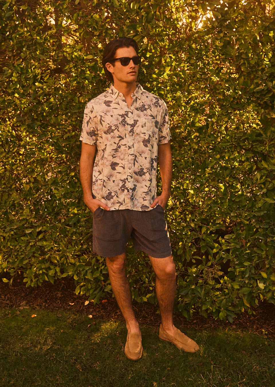 FULL BODY IMAGE OF MODEL WEARING CARSON SHIRT IN TROPICAL MIST AND CALEB SHORT IN THUNDER BLUE