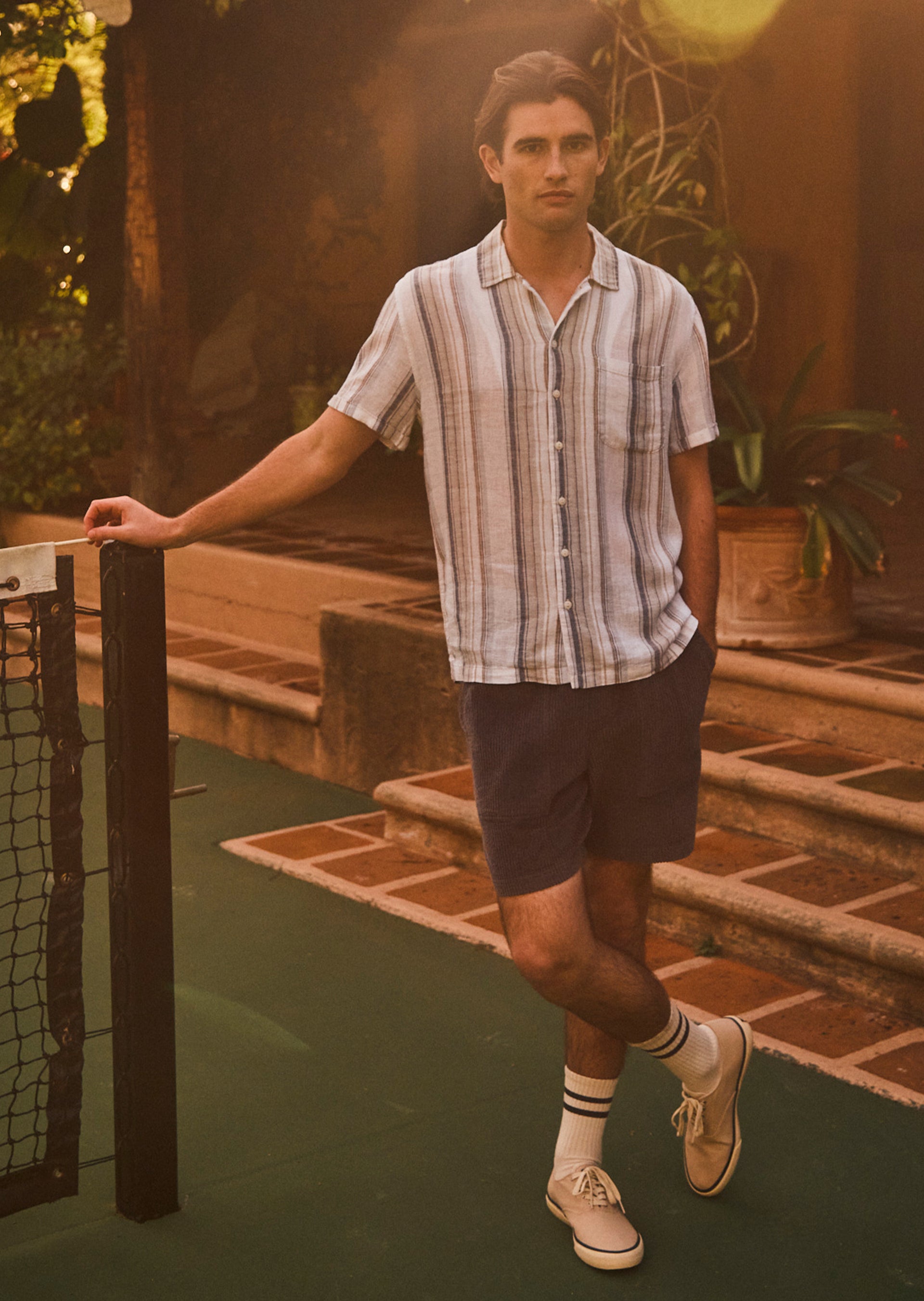 EDITORIAL IMAGE OF MORENO SHIRT IN BRUMA STRIPE AND CALEB SHORT IN THUNDER BLUE