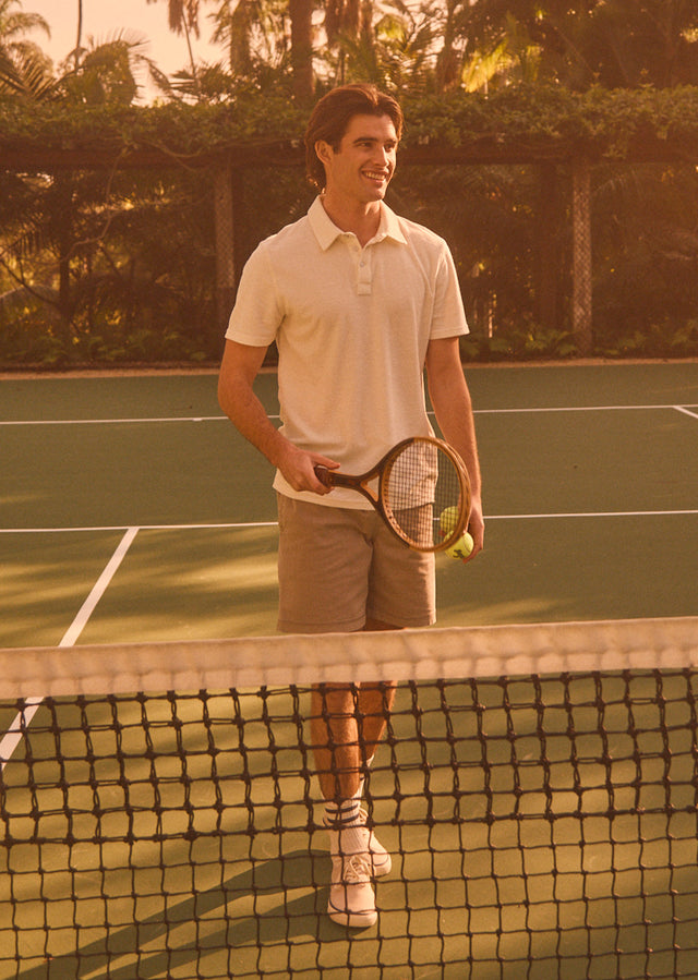 EDITORIAL IMAGE OF RHEN POLO SHIRT IN TERRY PEARL AND CRUZ SHORT IN WASHED GREY