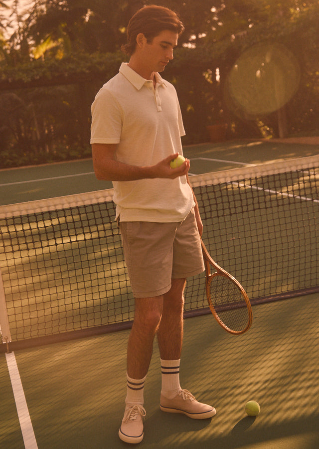 EDITORIAL IMAGE OF RHEN POLO SHIRT IN TERRY PEARL AND CRUZ SHORT IN WASHED GREY
