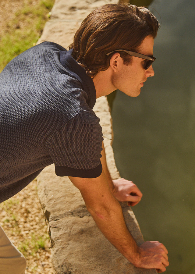 DETAIL IMAGE OF BACK OF SHOREDITCH POLO SHIRT IN NAVY BROCADE