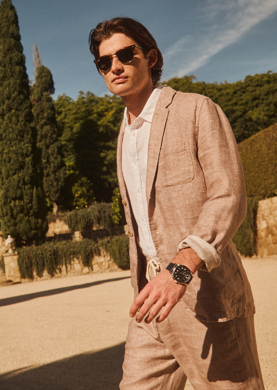 SIDE EDITORIA IMAGE OF MODEL WEARING SORRENTO BLAZER AND MERCER PANT IN BULGUR