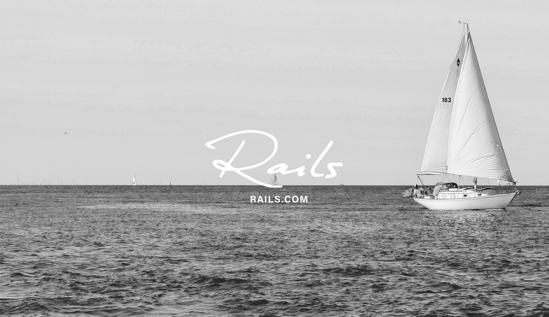 EDITORIAL IMAGE OF THE OCEAN WITH A SAIL BOAT