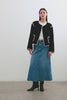 (Video): Melanie Jacket in Black shown on a model to showcase the heavy wool material, contrast stitching, button details, and boxy fit. Full Body View Featured on Model.