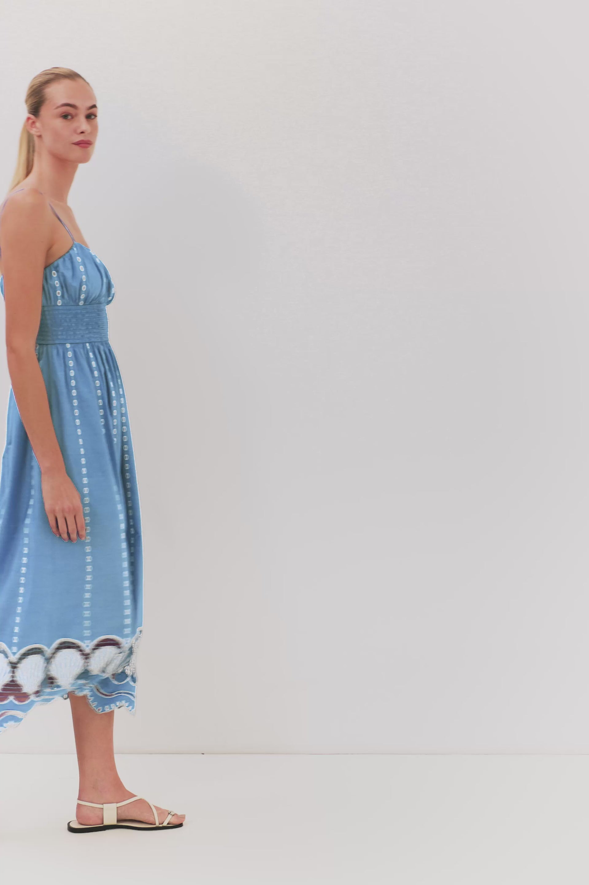 (Video): Murano sleeveless dress in French Blue, shown on a model to showcase the lightweight, flowing fabric.
