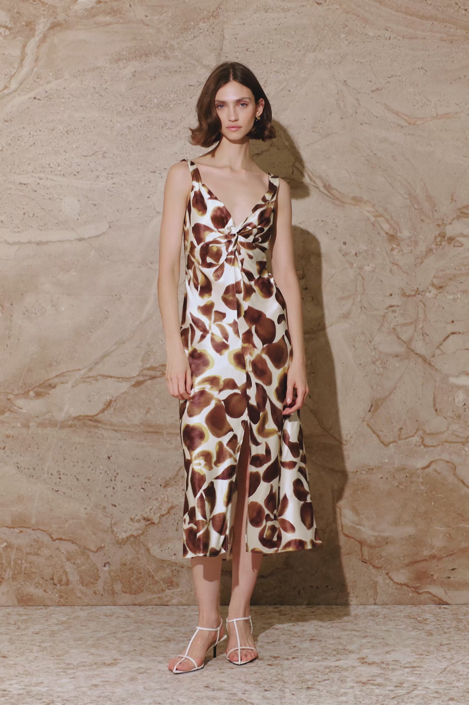 Viviana midi dress in Espresso Lily floral print, featuring a twisted sweetheart neckline, and a front slit - front full body view featured on model.