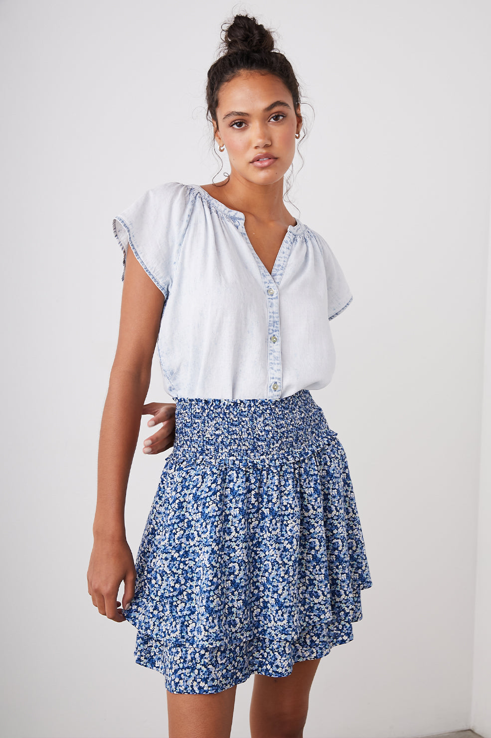 Addison Mini Skirt with a Smocked Waist and a Shorter Over Layer in Ice Chrysanthemum Colorway, Abstract Floral in White and Blues - Front View Featured on Model