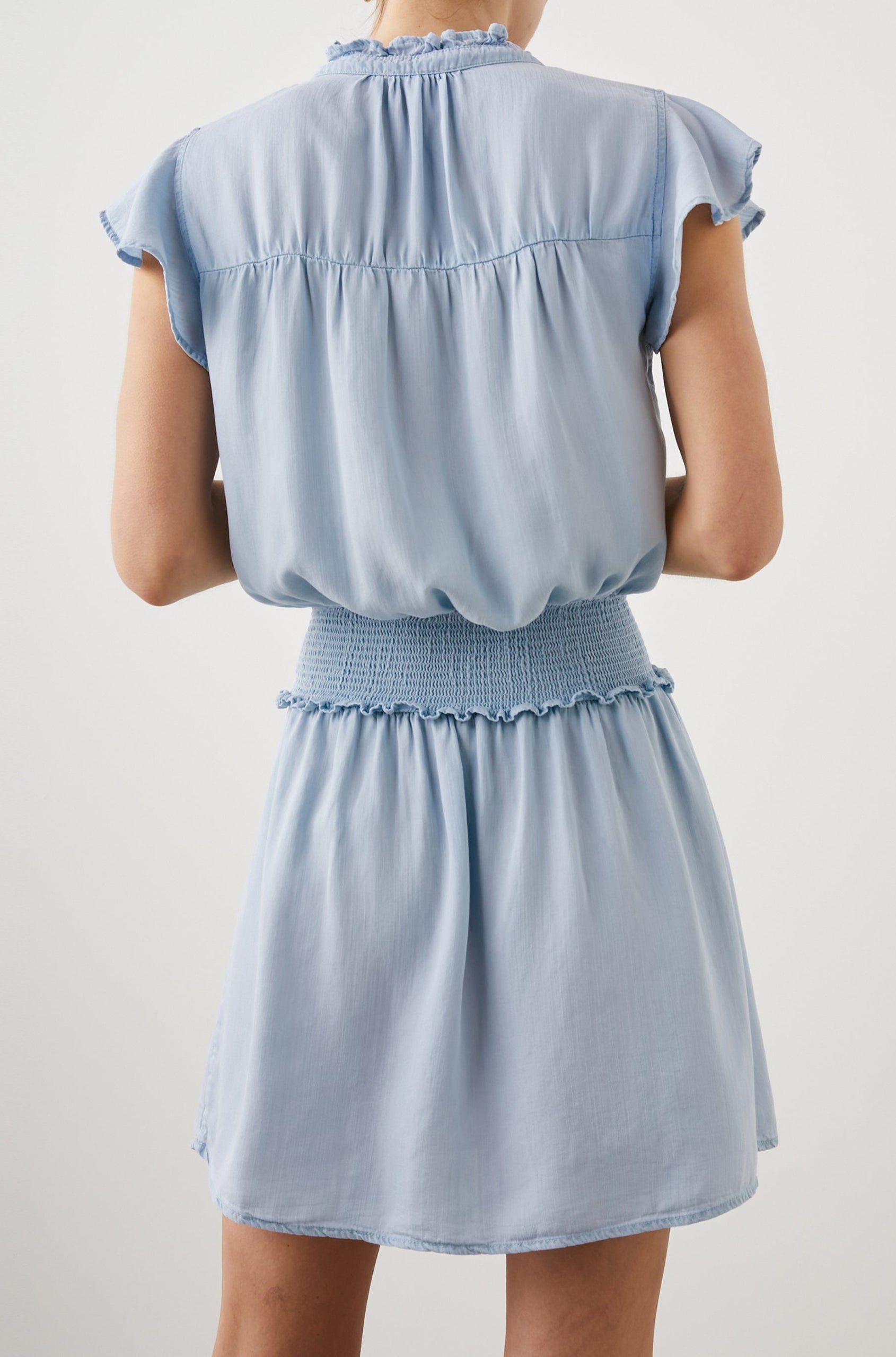 Amina Short Sleeve Mini Dress with Flutter Sleeves, a Ruffled Collar with Ruching, a Button Placket, and a Shirred Waist in Light Vintage Colorway - Back View Featured on Model 
